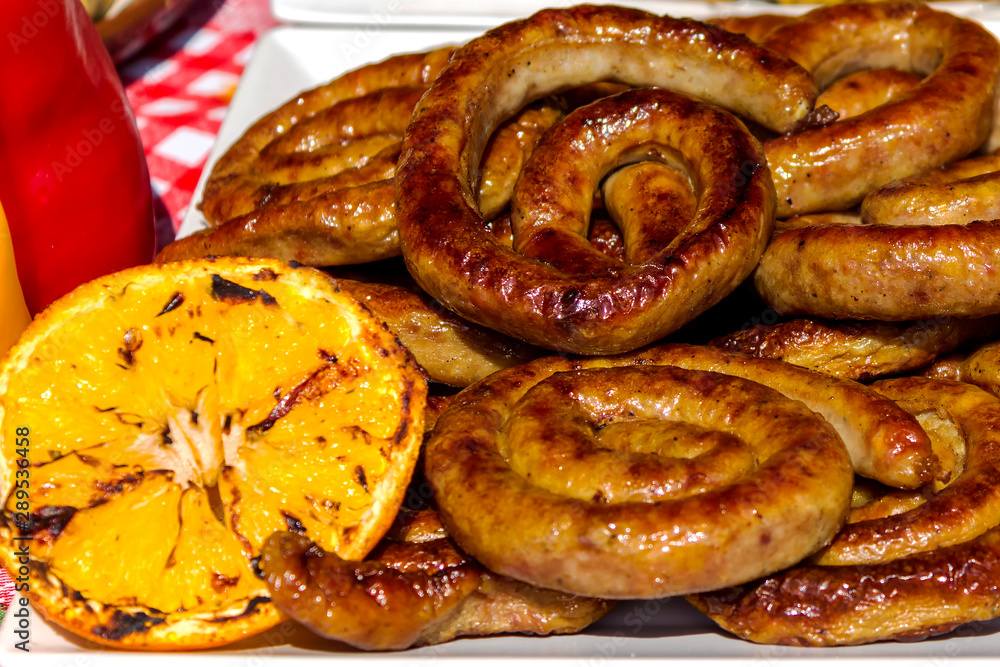 Delicious grilled sausages. Background of sausages. Delicious grilled sausages. Background of sausages.
