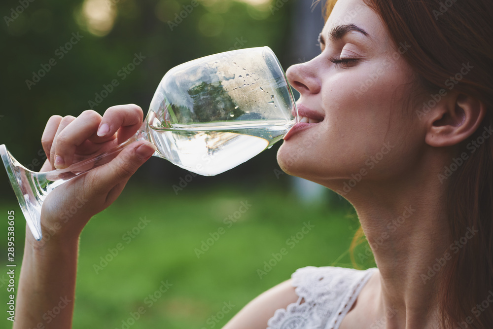 young woman with a glass of red wine