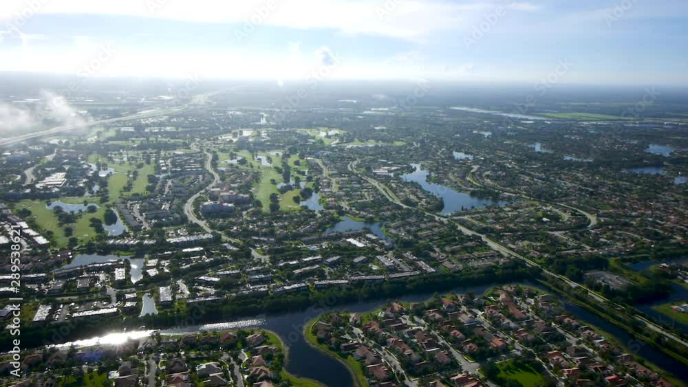 Aerial view flying above the clouds in Weston, Florida Aerial view flying above the clouds in Weston, Florida
