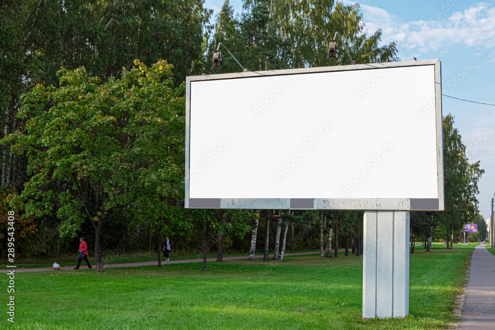 blank billboard, a large billboard on the background of the park and the street. UPS mock up isolated on white. - obrazy, fototapety, plakaty 