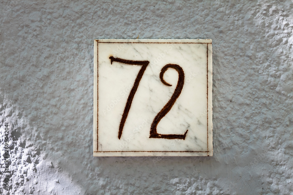 Fototapeta premium Street number sign on the wall
