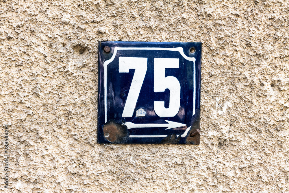 Street number sign on the wall Street number sign on the wall