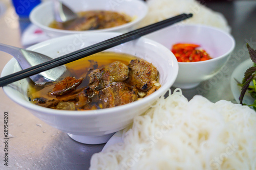 Bun Cha with grilled pork, rice noodles, vegetable and soup in vietnamese cuisine and street foods on VIETNAM HANOI