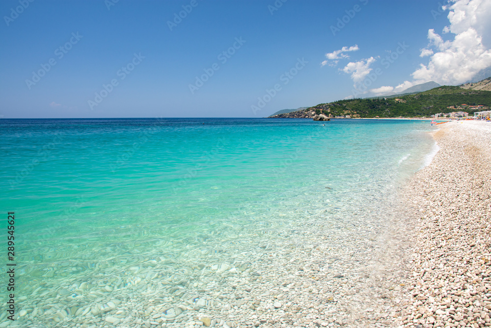 azur water of ionian sea on Livadhi beach in Himare, Albania