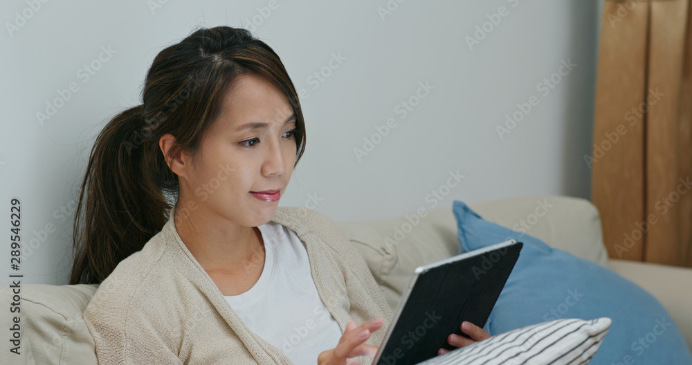 Woman watch on digital tablet computer at home Woman watch on digital tablet computer at home