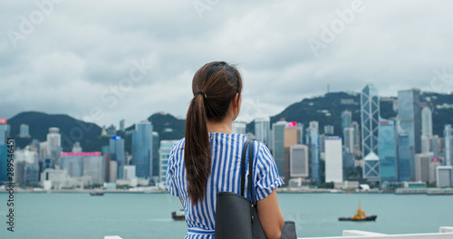 Photography Woman look around the beautiful view in Hong Kong