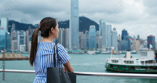 Photography Woman look around the beautiful view in Hong Kong