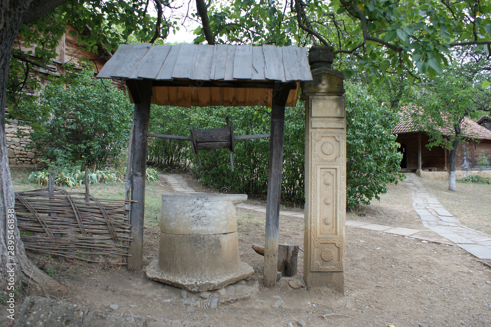 ancient stone well. antique well carved in solid stone ancient stone well. antique well carved in solid stone