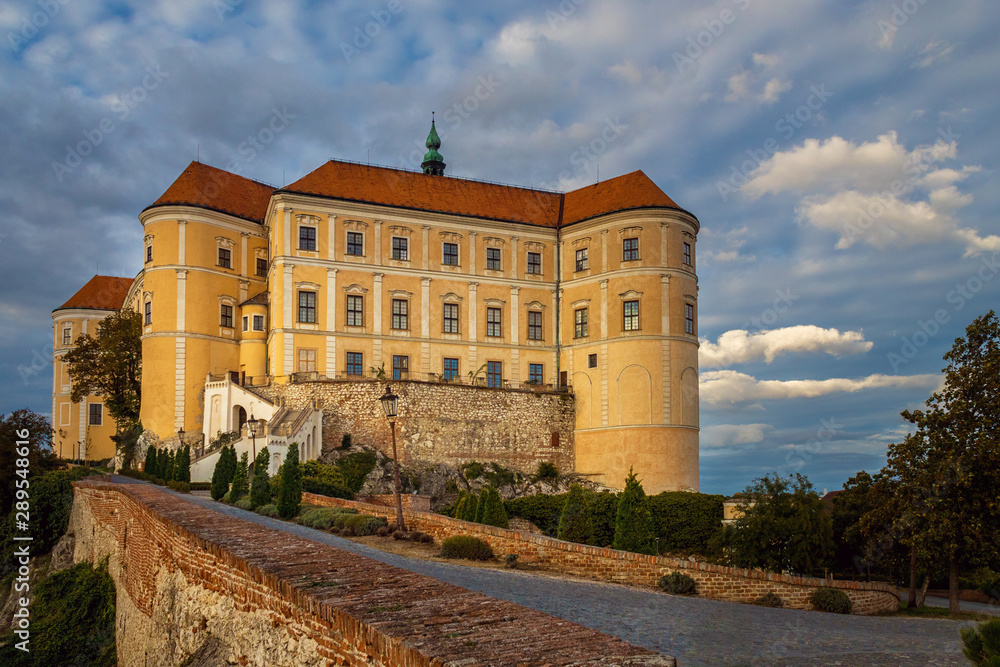 Baroque Castle Mikulov, Czech republic, paved road in the foreground, autumn evening