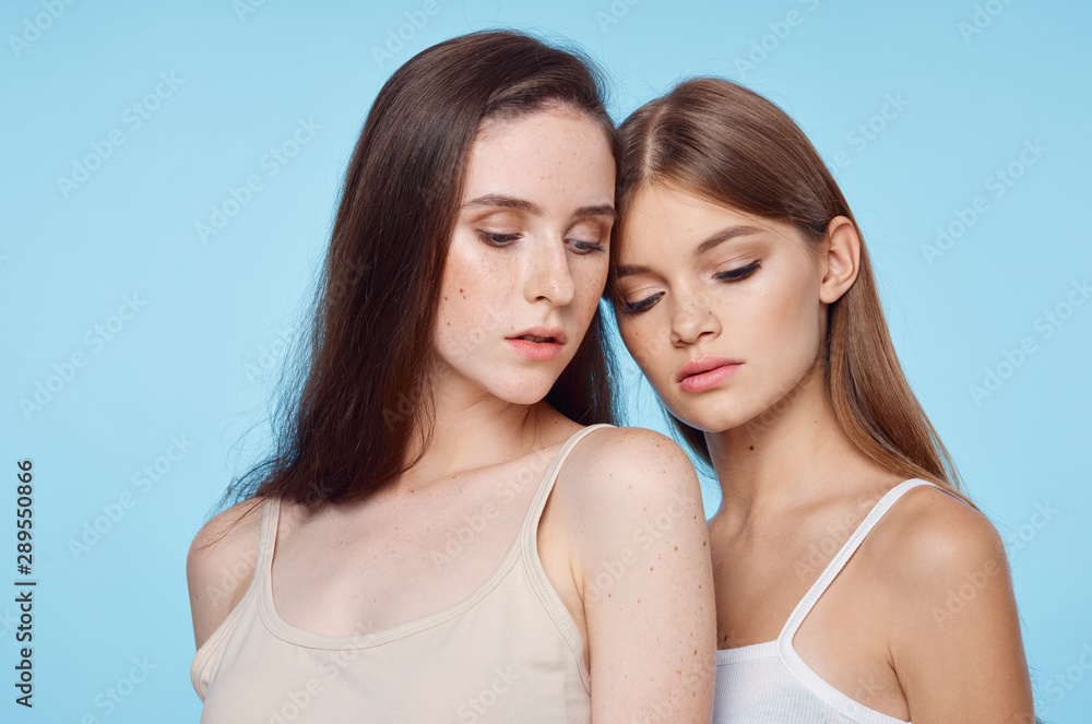 two girls in front of mirror two girls in front of mirror