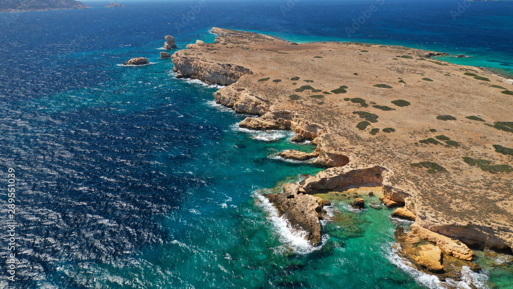 Aerial drone photo of small islet of Glaronisi with paradise emerald clear sea rocky beaches, Koufonisi island, Small Cyclades, Greece
