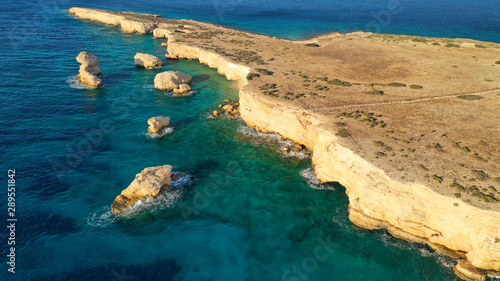 Aerial drone photo of small islet of Glaronisi with paradise emerald clear sea rocky beaches, Koufonisi island, Small Cyclades, Greece