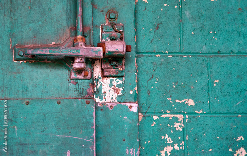 rusty metal handle to old warehouse door
