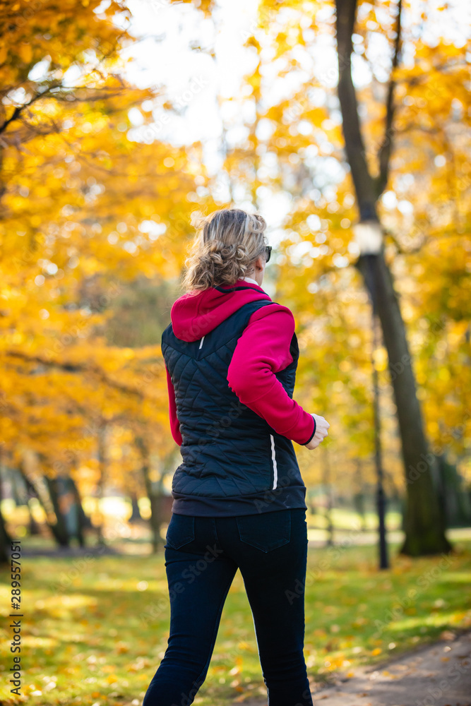 Healthy lifestyle - woman running in city park Healthy lifestyle - woman running in city park