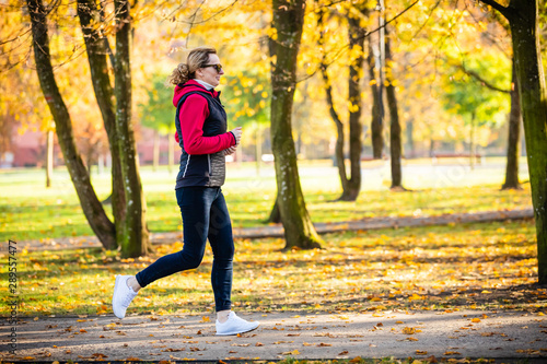 Healthy lifestyle - woman running in city park