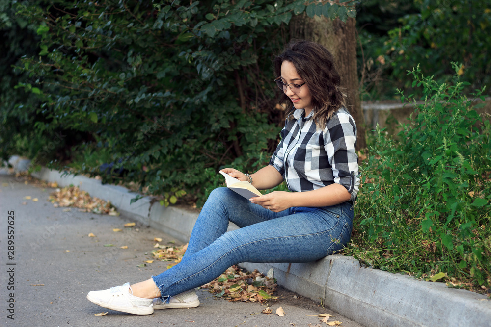 girl in the park reads a book girl in the park reads a book