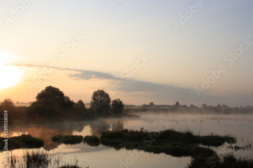 Dawn in the early morning with light fog on the river