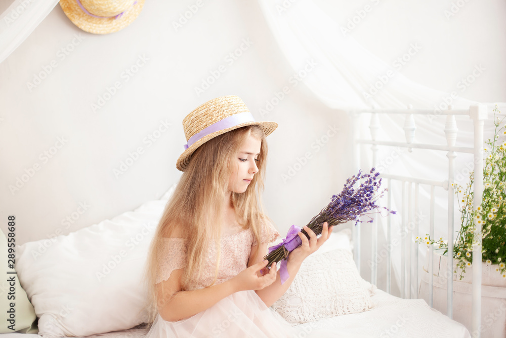 gardening and people concept happy young woman smelling lavender flowers. Cute little Girl holds a bouquet of lavender. Lifestyle concept. Aromatherapy Wildflowers. Summer flower. childhood. provence	