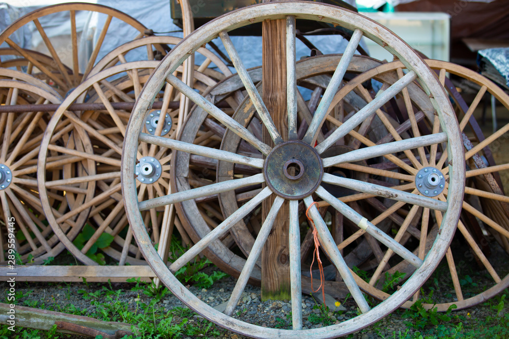 Old antique vintage wood wagon  with retro wheels