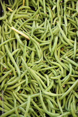 Close-up full frame view of fresh organic green beans displayed at a farmers market stand