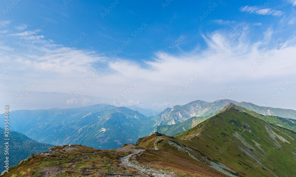 Fototapeta premium Tourists walking along the ridges of the mountains in the Tatras