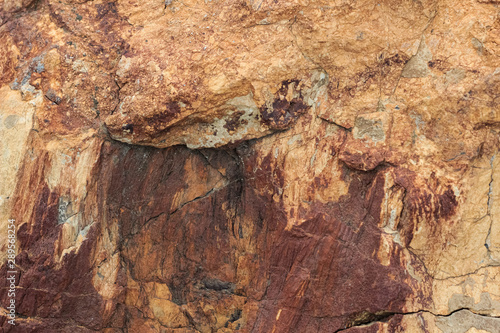 The texture of red natural natural stone.