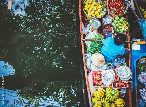 Canvas Print floating market - top view of boat full of fresh fruits on sale