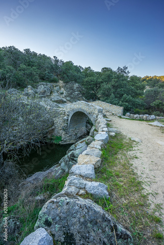 Puente del pasadero bridge. Navalagamella, Madrid, Spain. The origin is not clear, but it was presumably built during the  unification of Muslim-ruled Iberia photo