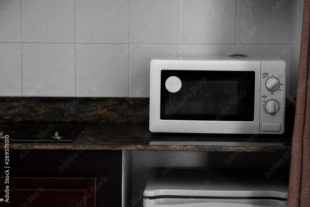 Obraz premium Microwave in a kitchen for cooking or heating a dish.