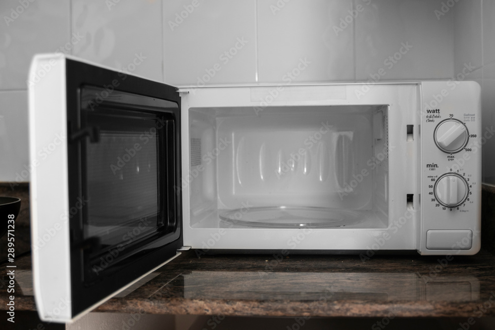 Obraz premium Microwave in a kitchen for cooking or heating a dish.