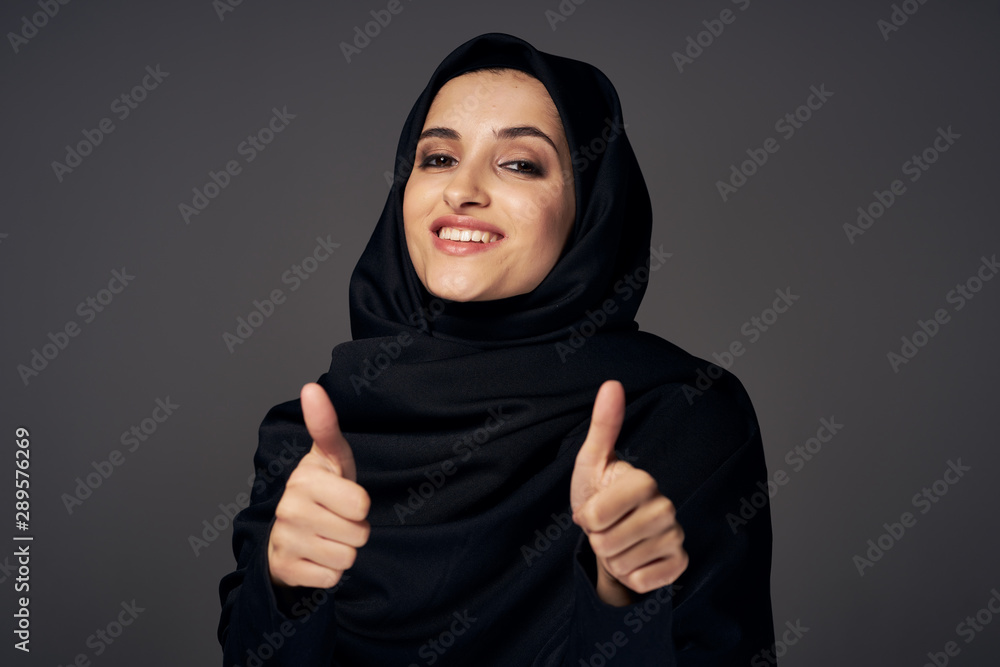 young woman with thumbs up