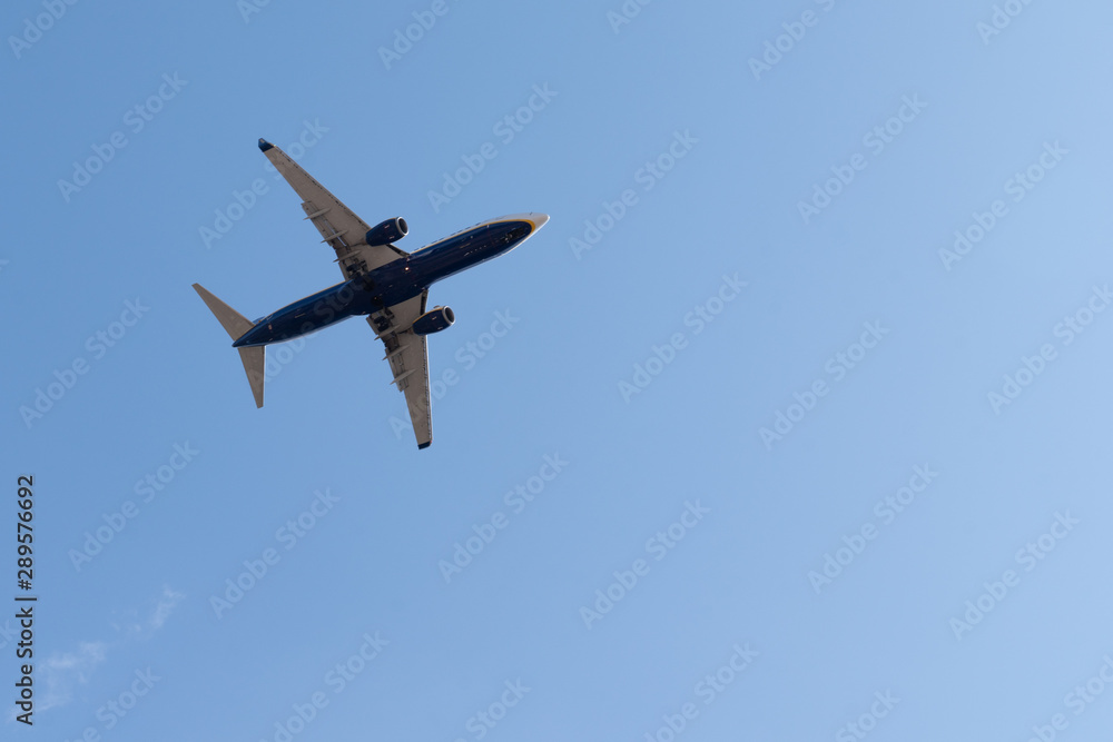 Airplane flying in the blue sky with copy space Airplane flying in the blue sky with copy space