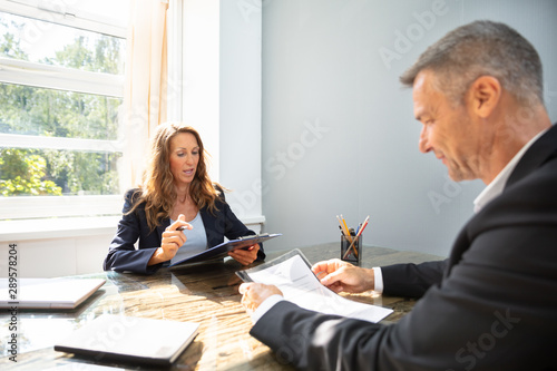 Businesswoman Taking An Interview Of Man