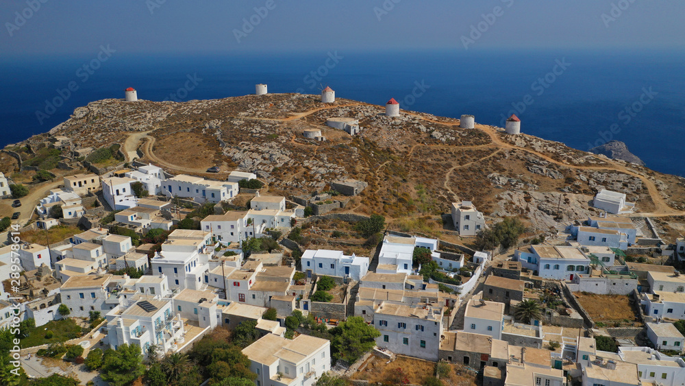 Fototapeta premium Aerial drone panoramic photo of picturesque main village or chora and castle of Amorgos island built on top of cliff overlooking the Aegean blue sea, Cyclades, Greece