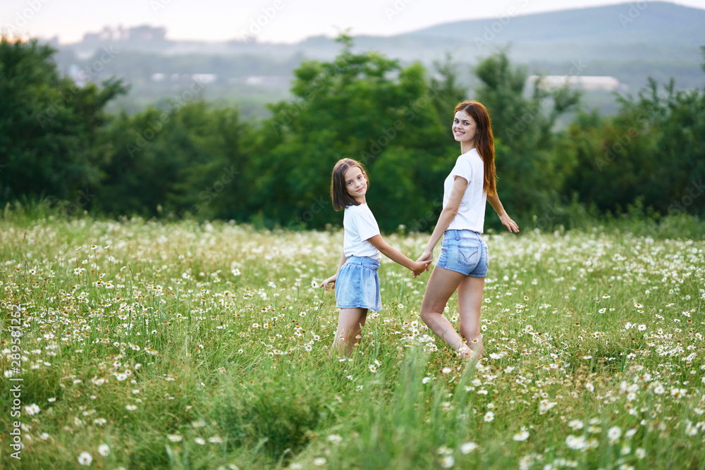 Fototapeta premium mother and daughter in the field