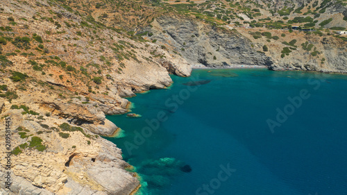 Aerial drone photo of paradise small beach of Mouros with caves and crystal clear sea, Amorgos island, Cyclades, Greece