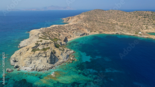 Aerial drone photo of secluded paradise beach of Gramvousa in small island of Gramvousa near Kalotaritissa with emerald clear sea, Amorgos island, Cyclades, Greece photo