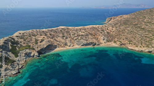 Aerial drone photo of secluded paradise beach of Gramvousa in small island of Gramvousa near Kalotaritissa with emerald clear sea, Amorgos island, Cyclades, Greece