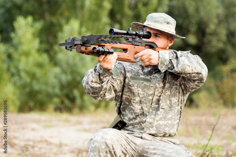 Fototapeta premium army soldier shooting with crossbow