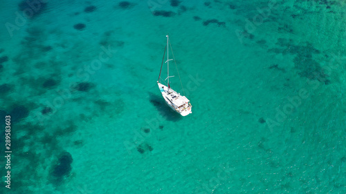 Aerial drone top down photo of sail boat in old port of Mykonos island, Cyclades, Greece
