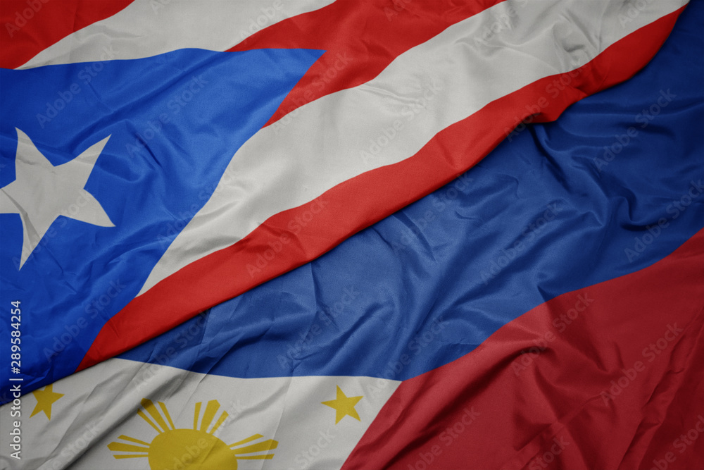 waving colorful flag of philippines and national flag of puerto rico. waving colorful flag of philippines and national flag of puerto rico.
