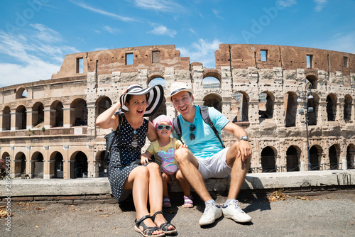 Photography Young Family Sitting In Front Of Colosseum