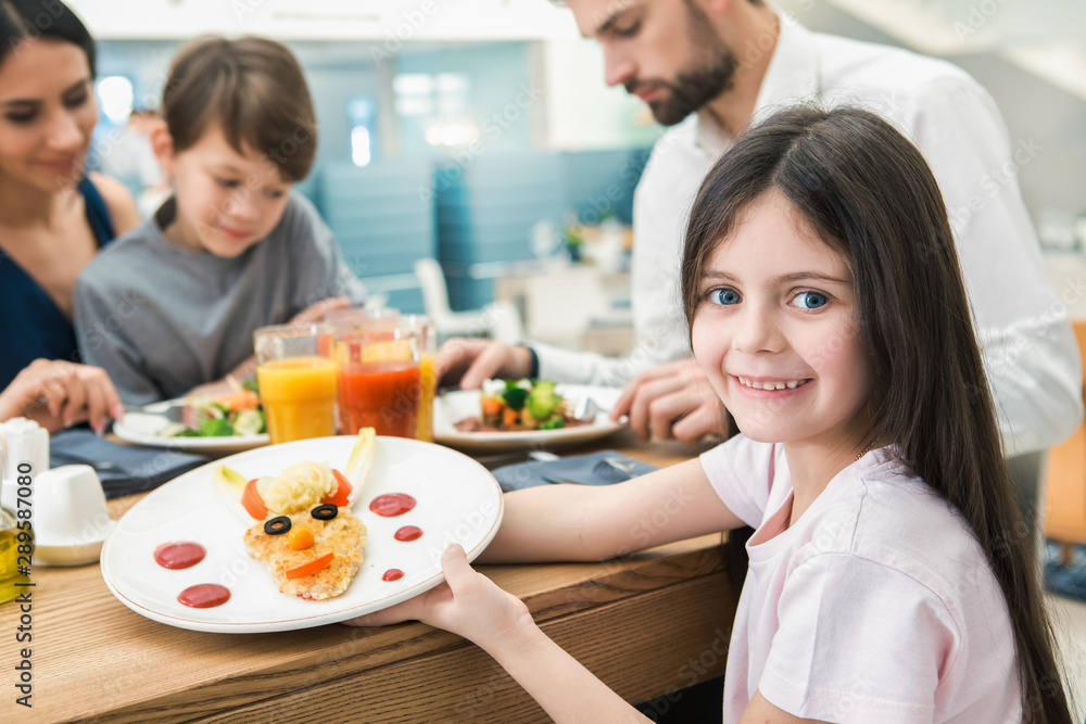 Family Sitting Together in the Restaurant Lunch Concept Family Sitting Together in the Restaurant Lunch Concept