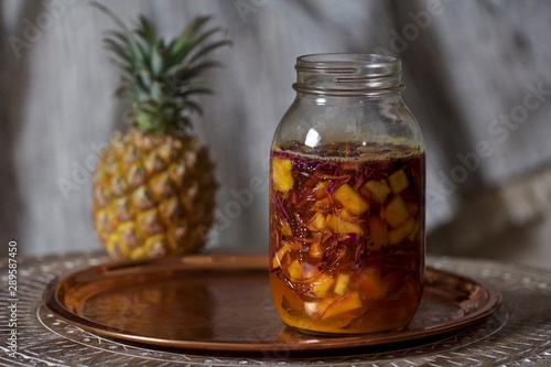 Pineapple Turmeric Sauerkraut Fermented in Mason Jar photo