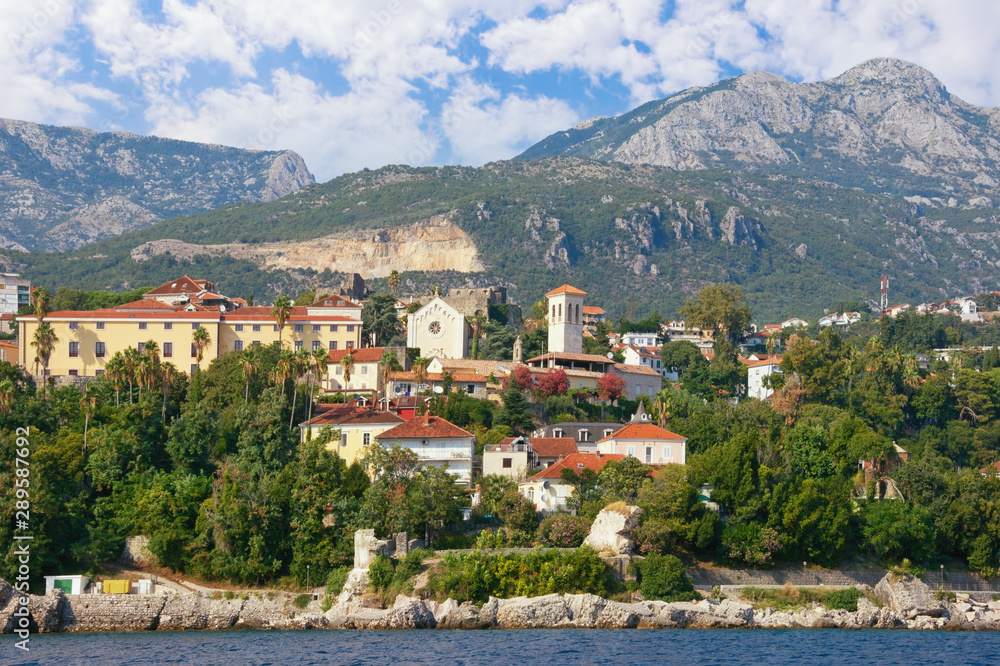 Beautiful Mediterranean landscape. Montenegro, Adriatic Sea. View of Old Town of Herceg Novi city from sea. View of Bell tower of Saint Jerome Church