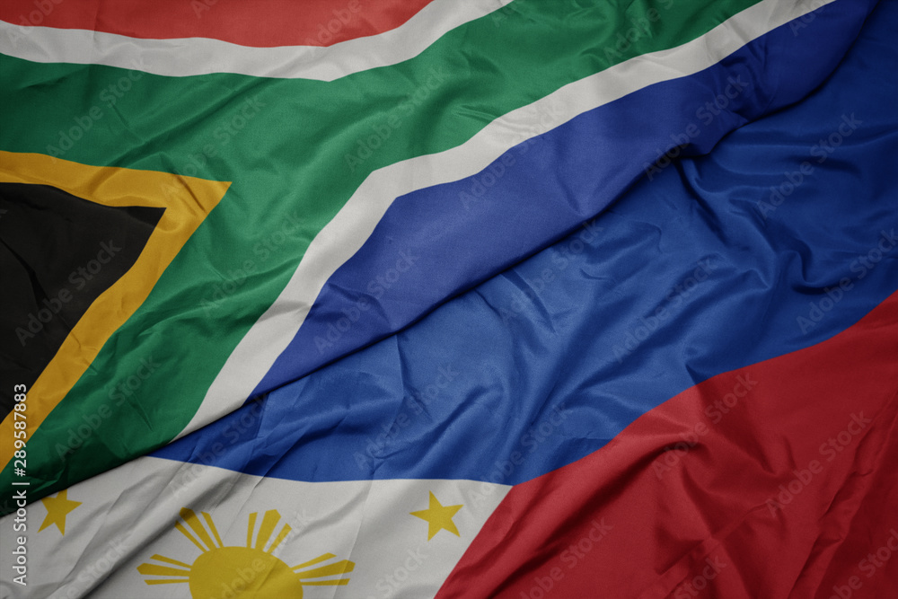 waving colorful flag of philippines and national flag of south africa. waving colorful flag of philippines and national flag of south africa.