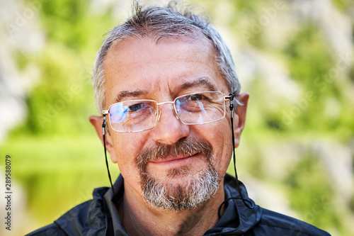 Obraz na plátne Smiling intellectual with glasses and a beard.