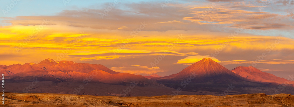 Panorama sunset in the Atacama desert with the Moon Valley and the Licancabur volcano located near San Pedro de Atacama, Chile.