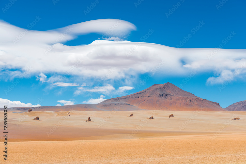 The magnificent Dali Desert near the Uyuni Salt Flat (Salar de Uyuni) with rock formations and clouds that could have been drawn by the master himself, Bolivia, South America. The magnificent Dali Desert near the Uyuni Salt Flat (Salar de Uyuni) with rock formations and clouds that could have been drawn by the master himself, Bolivia, South America.