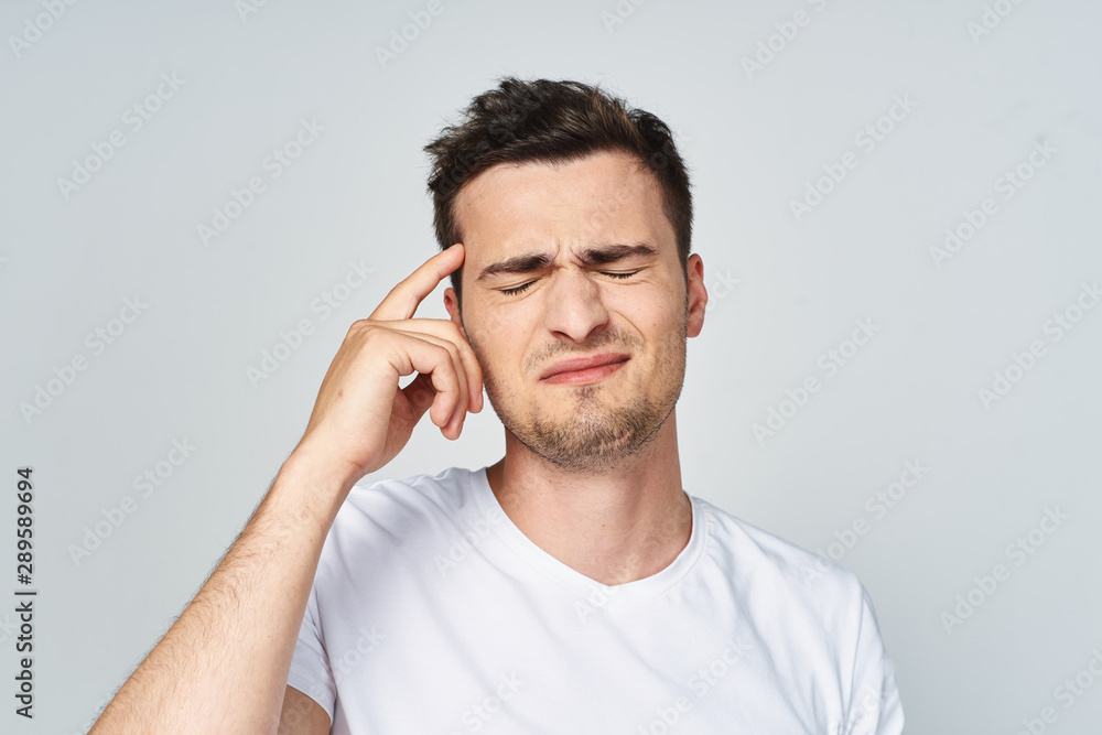 young man talking on the phone isolated on white young man talking on the phone isolated on white